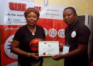 Rise Networks' Founder, Mrs. Toyosi Akerele-Ogunsiji presenting the Certificate of Fellowship to one of the Fellows. #NSLP2016